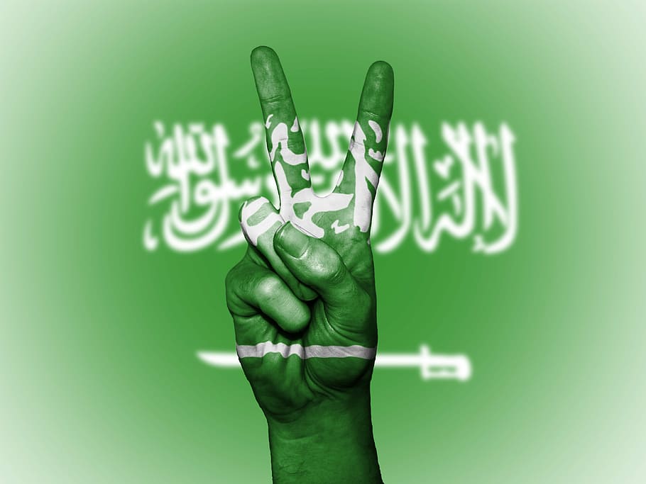 white text on green and white background, saudi arabia, peace