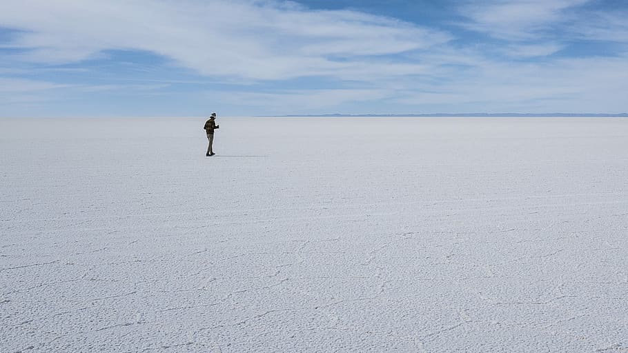Don’t Stray Too Far!, man standing on salt flats, mountain HD wallpaper