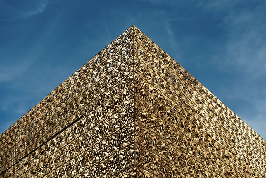 low angle of building, gold-colored building during blue sky HD wallpaper