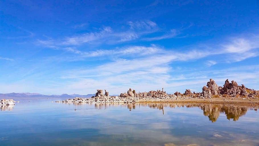 brown island on body of water, blue body of water, lake, cloud HD wallpaper