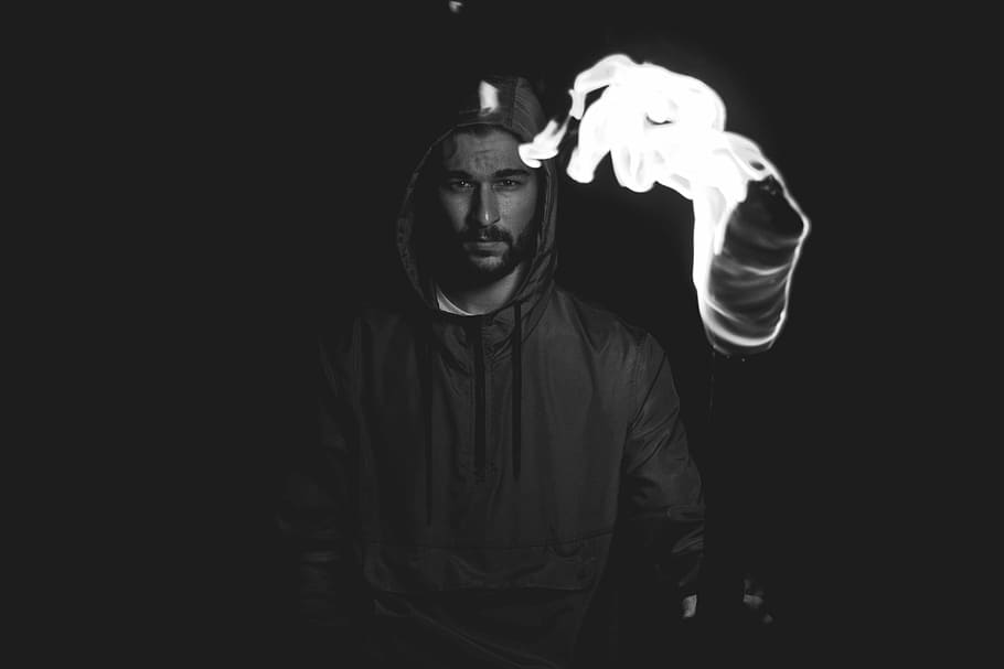 grayscale shot of man holding torch, man in black pullover hoodie HD wallpaper