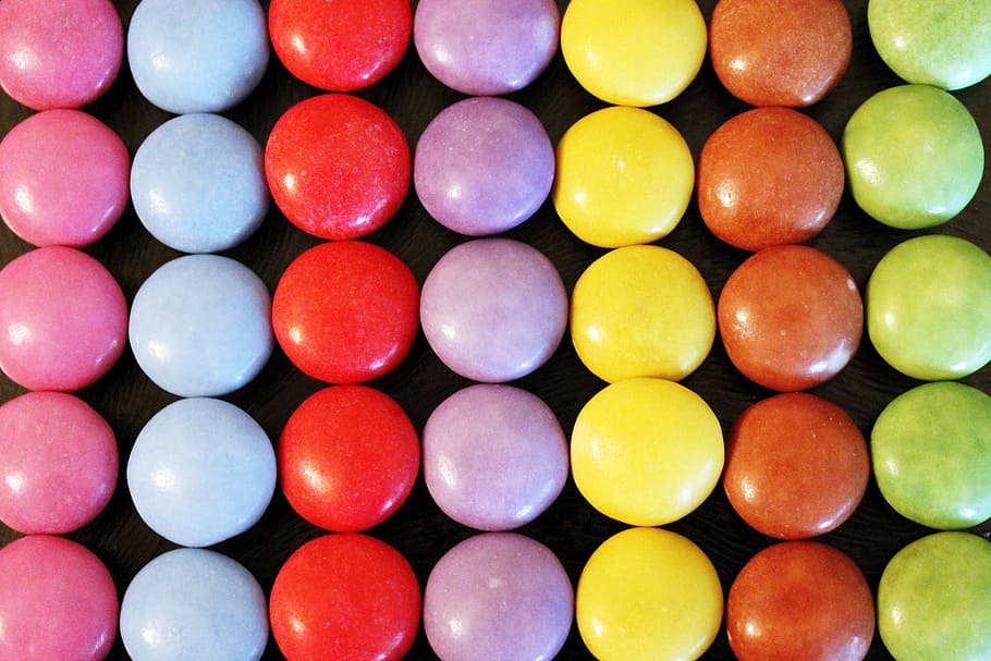 assorted-color candy lot on black surface, smarties, colorful, HD wallpaper