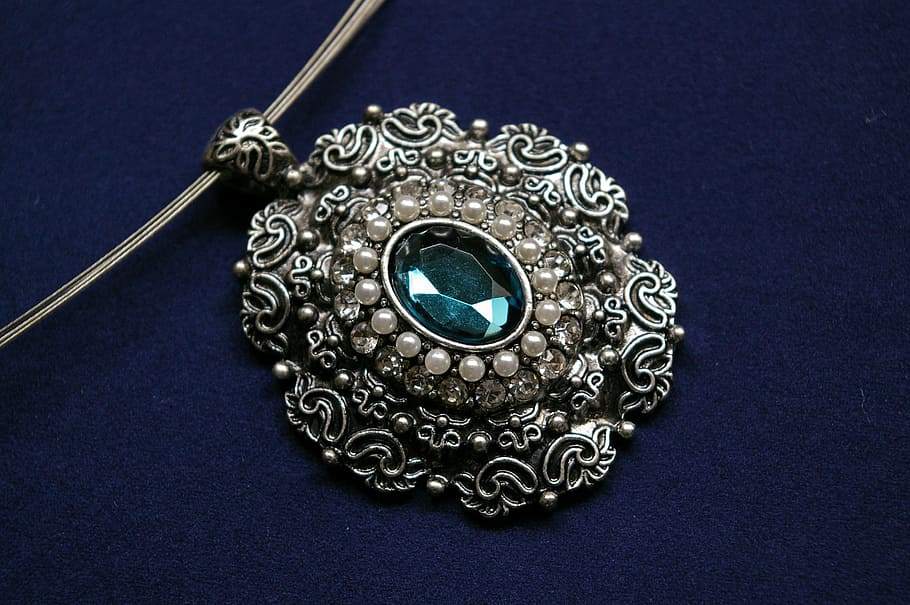 silver-colored pendant with cyan gemstone on blue velvet textile, HD wallpaper