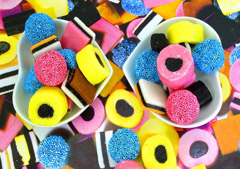 photo of yellow, pink, and blue candies, candy, licorice, colors HD wallpaper