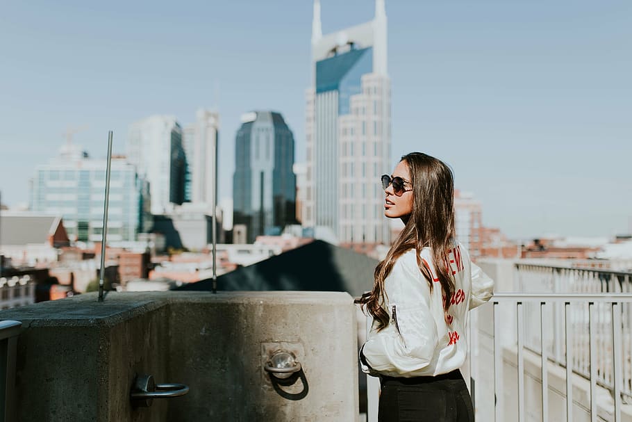 woman standing near white metal fence, long, sleeved, shirt HD wallpaper