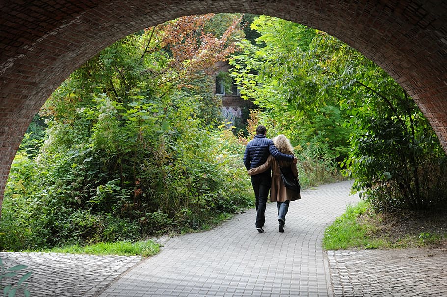 man and woman walking in between trees, bridge, pair, couple HD wallpaper