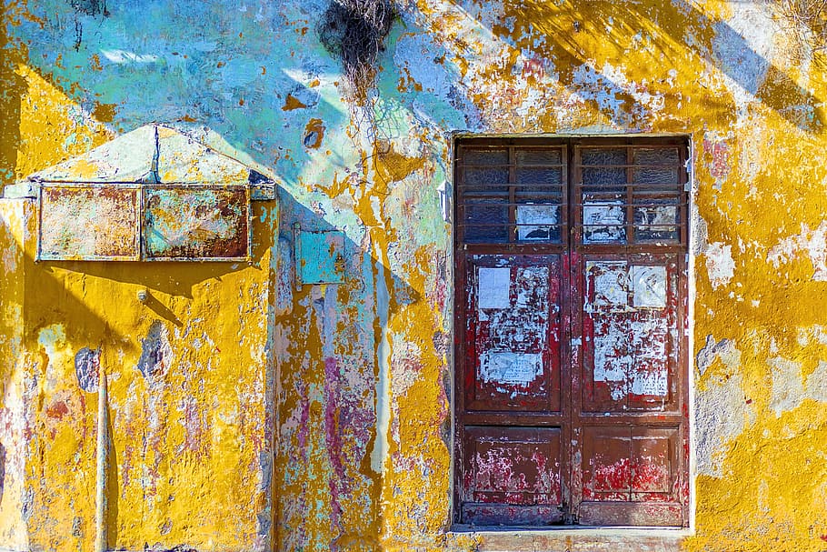 yellow, white, and teal painted concrete wall with red wooden 2-door window, yellow painted building with red wooden doors HD wallpaper