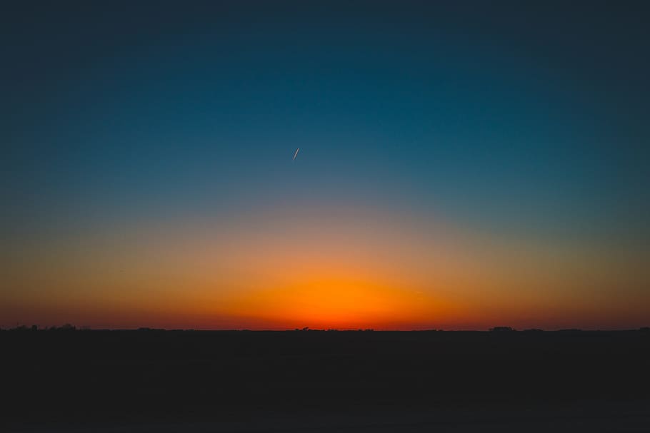 photography of horizon, sunset, sky, glow, orange, blue, silhouette HD wallpaper