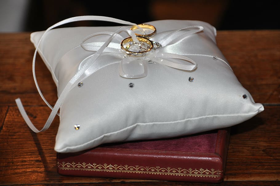 gold-colored rings on gray cushions, alliances, wedding, happiness