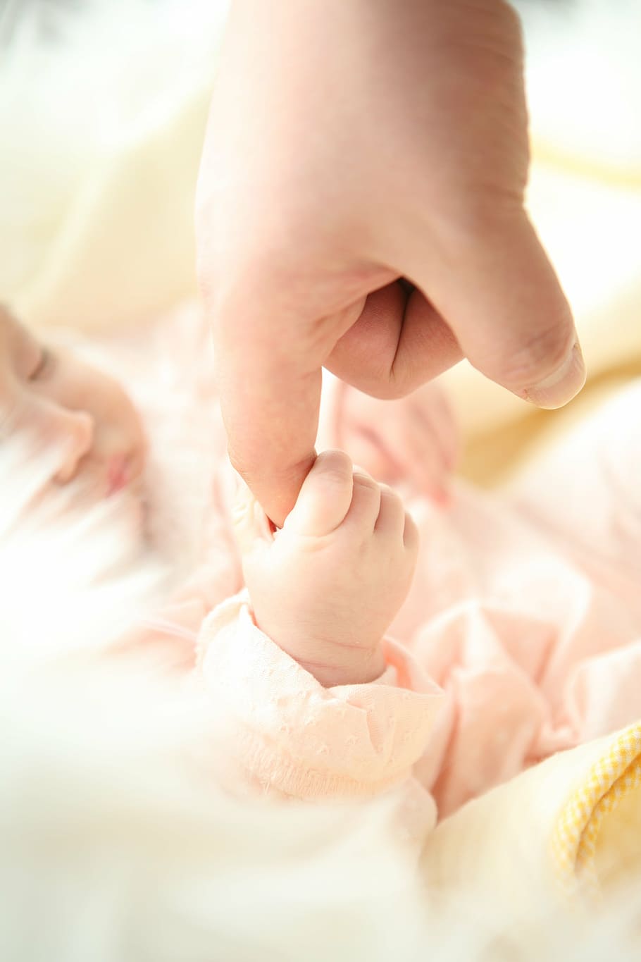 baby holding index finger of person, hand, dad, child, human Hand