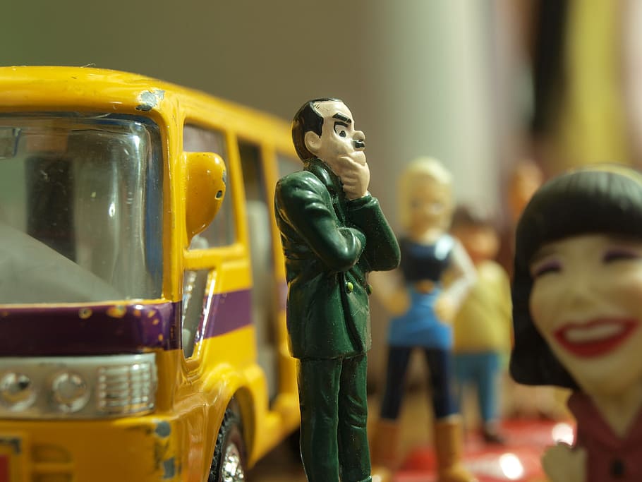shallow focus photography of man in green suit coat plastic toy, HD wallpaper