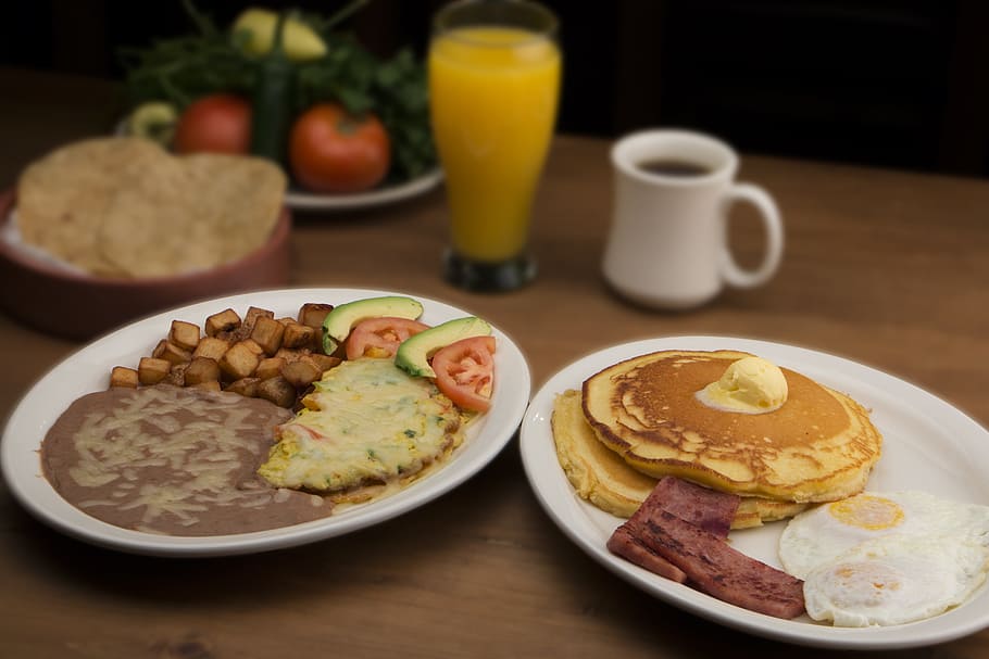 baked pancakes with egg and bacon strip on white ceramic plate HD wallpaper