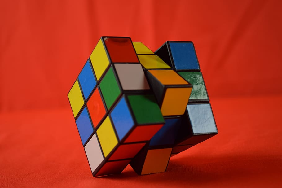 rubick's cube on red cloth, toy, ingenious, rubik cube, multi colored HD wallpaper
