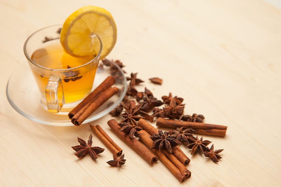 tea beside cinnamon rolls and arnis, Lemon, Anise, Seasonings