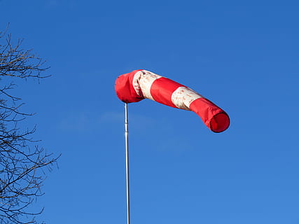 red and white striped flag under blue sky, wind direction indicator HD wallpaper