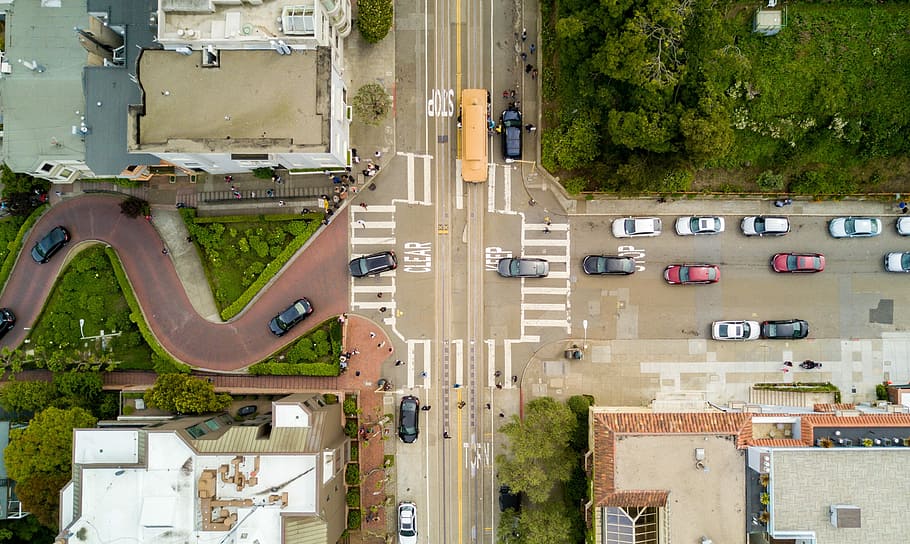 aerial photography of people and vehicles on cross road, aerial photo of vehicles cruising on road during daytime HD wallpaper