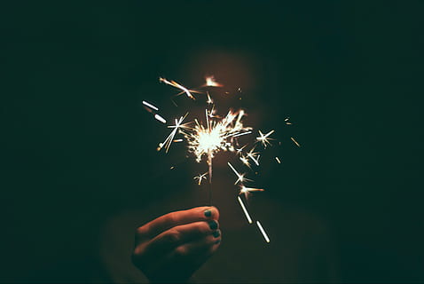 person holding lighted sparkler, person holding sparkler, firecracker HD wallpaper