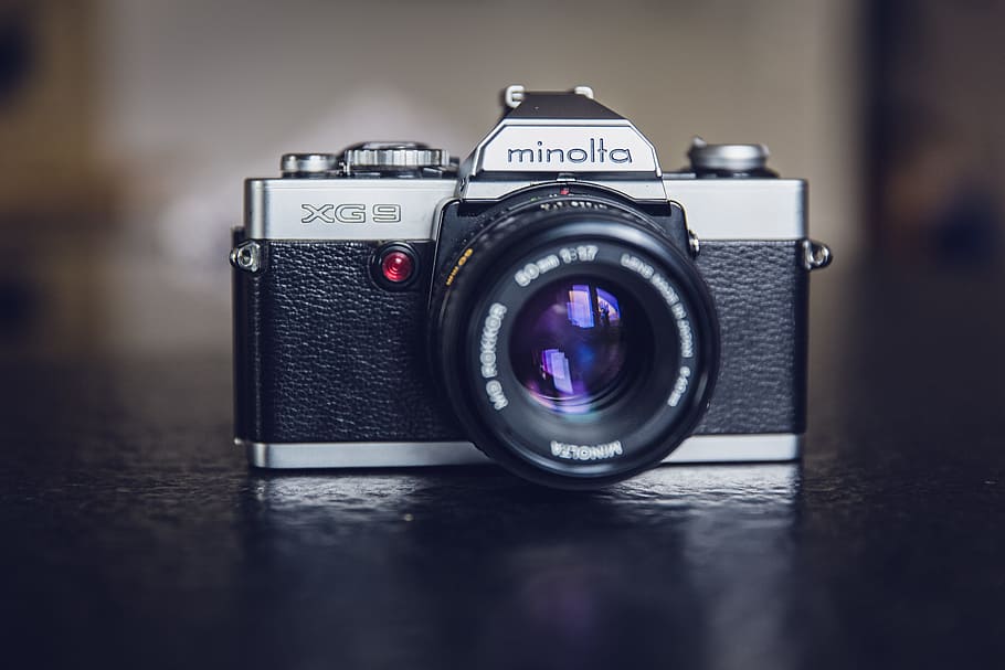 photo of black and gray Minolta XG3 DSLR camera, analog, antique