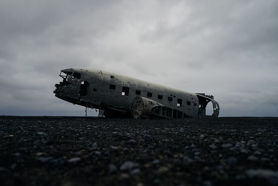 white plane on gray surface, abandoned plane on ground under white clouds HD wallpaper