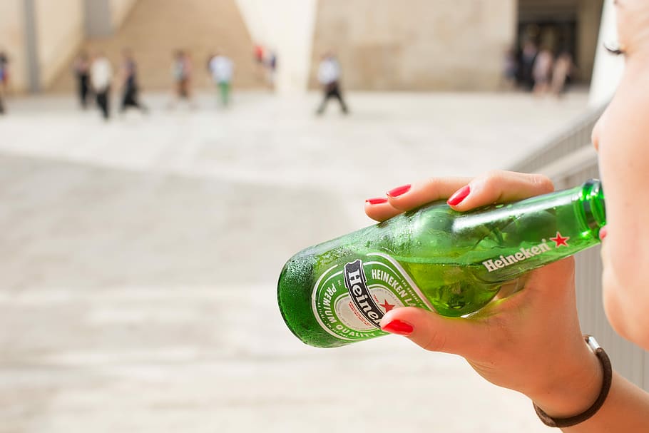 Heineken beer bottle, drink, drinking, hands, outside, people
