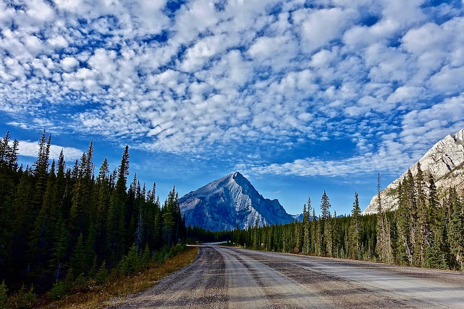 mountain ranges under cloudy sky, road, highway, perspective HD wallpaper