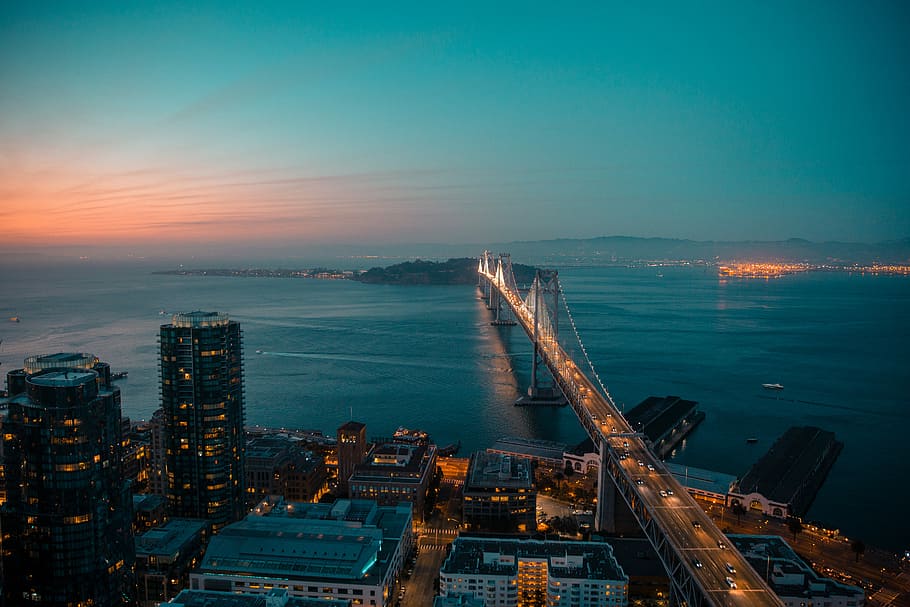 Oakland Bridge, aerial photography of lightened bridge near body of water during golden hour, HD wallpaper