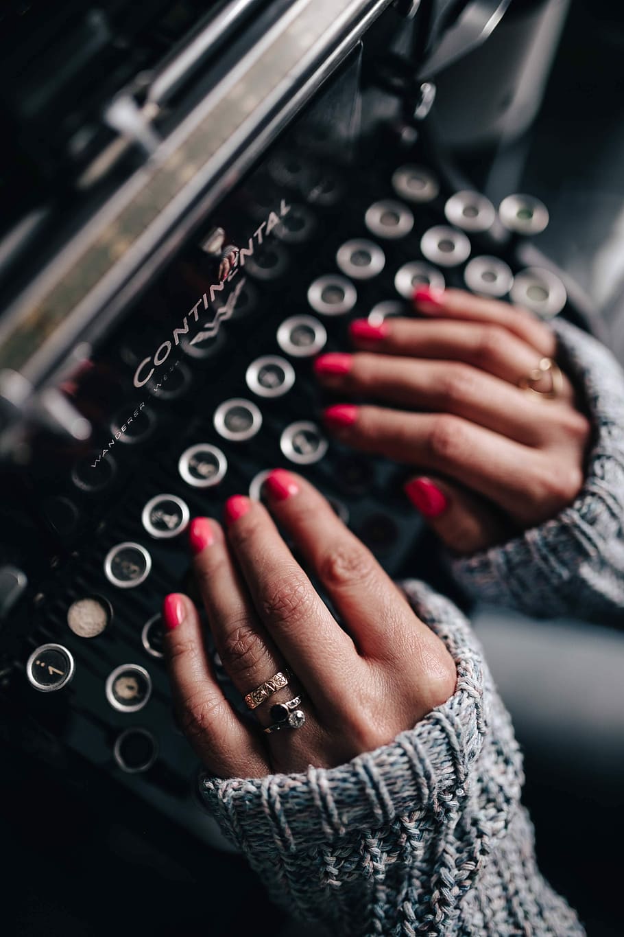 Woman typing on an old typewriter, female, vintage, office, desk