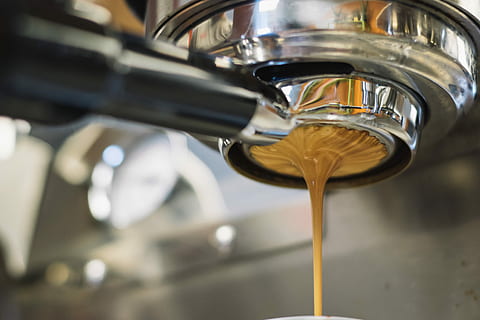 Latte dripping from a coffee machine, stainless steel espresso machine HD wallpaper