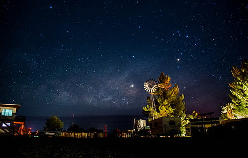 Texas Night Sky, white RV trailer next to green trees, windmill HD wallpaper