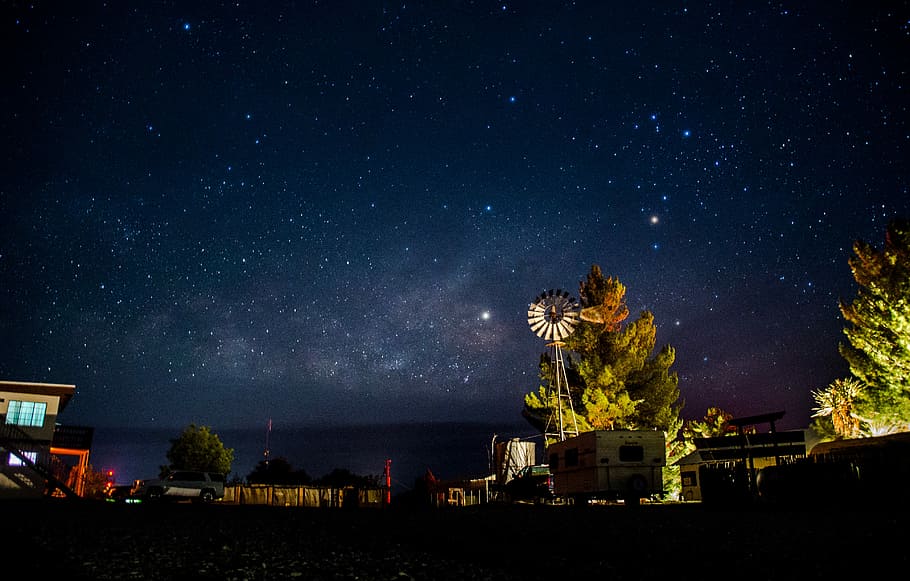 HD wallpaper: Texas Night Sky, white RV trailer next to green trees ...