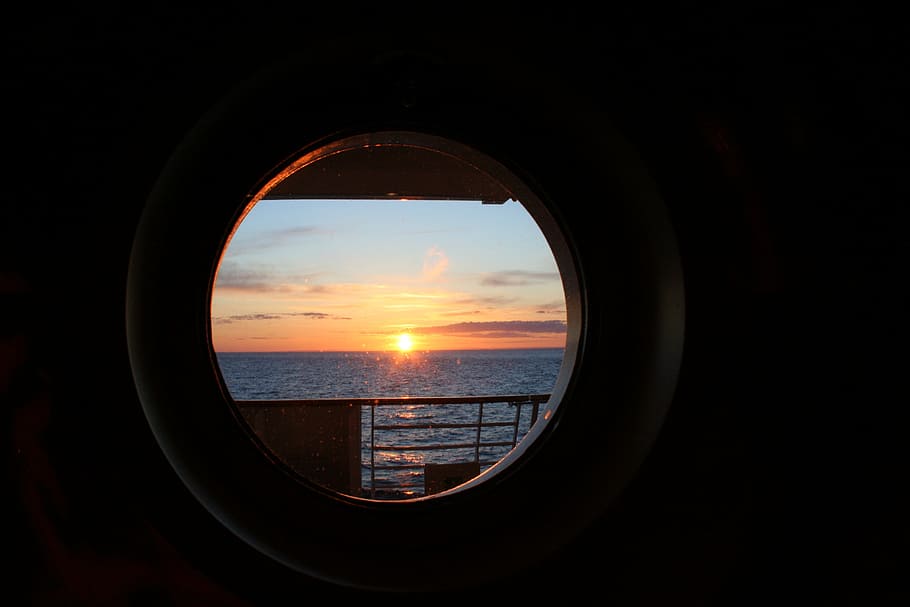 sunset view on window, lucke, water, north sea, boats, ships
