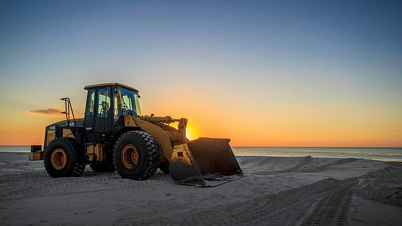 yellow and black bulldozer parked on grey sand, machinery, equipment HD wallpaper