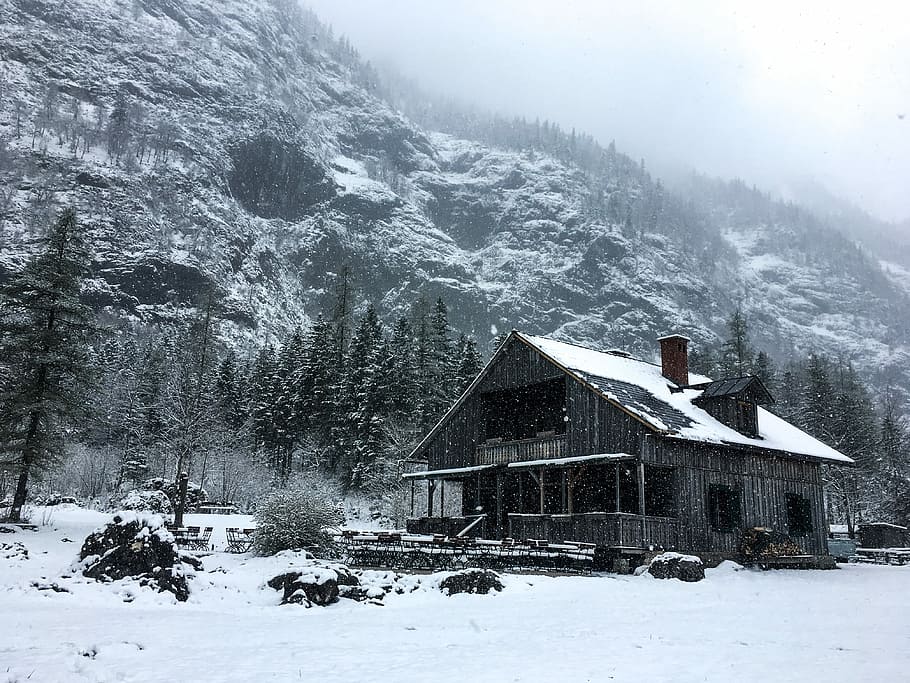 gray house near mountain, wooden house under snowfield beside mountain HD wallpaper