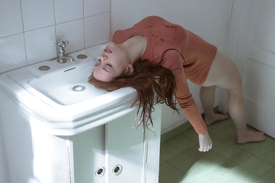 waking dream, photo of bottomless woman wearing brown top in unconscious condition