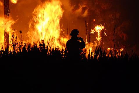 silhouette of man surrounded by fire, flames, night, outdoors HD wallpaper