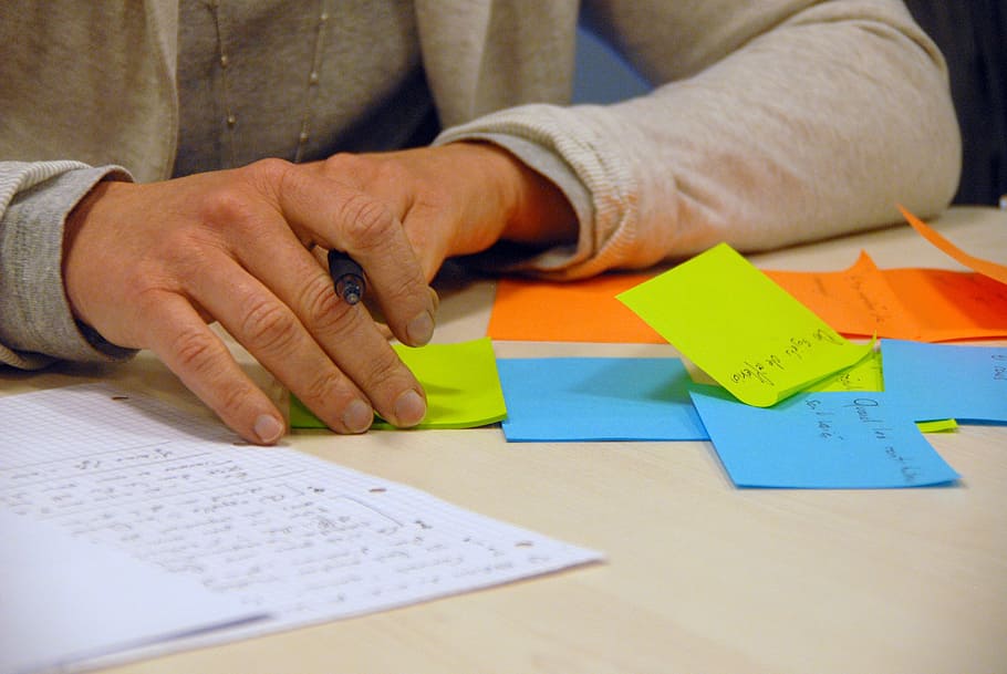 person with assorted-color sticky notes, brainstorming, business HD wallpaper