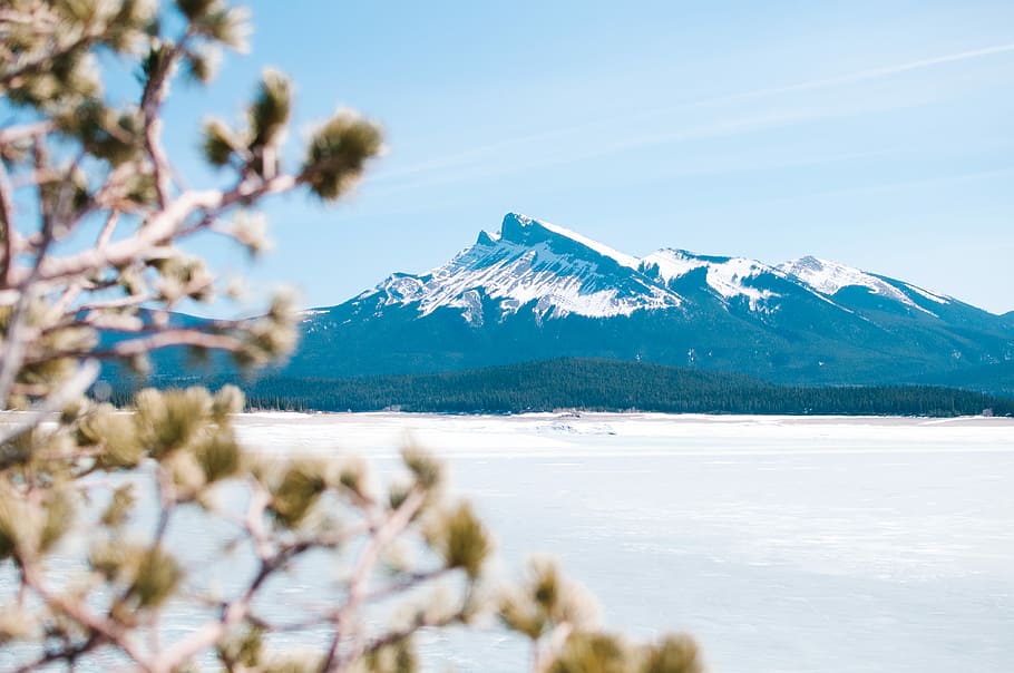 photo of mountain under white sky, landscape photography of mountain covered with snow during daytime HD wallpaper