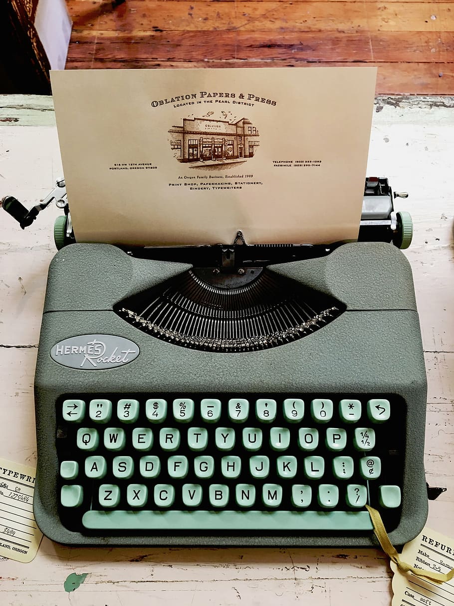 gray typewriter, teal, hermes, rocket, oblation, papers, press