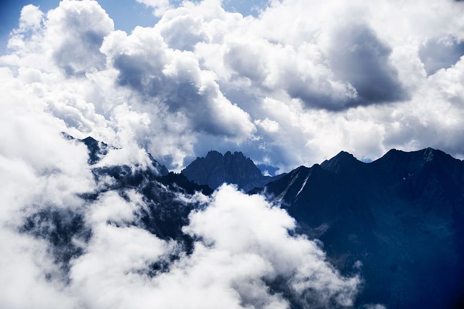 silhouette of mountain covered with white clouds during daytime, mountains and white clouds HD wallpaper