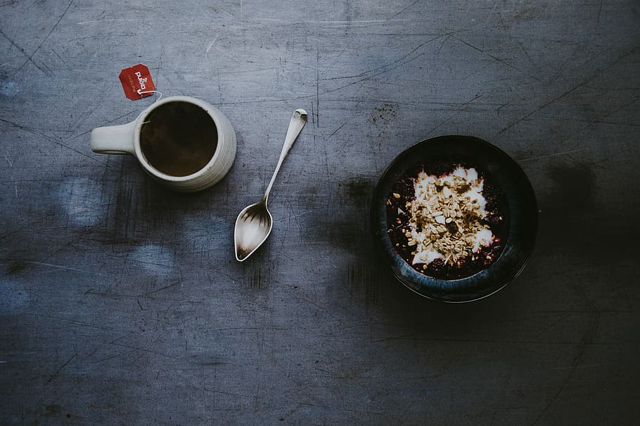 Breakfast, granola, yoghurt, berries, tea, white mug, gray spoon and black bowl HD wallpaper