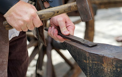 selective focus photography of person using hammer ], forge HD wallpaper