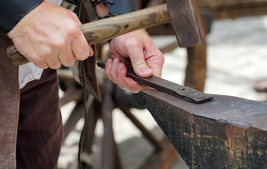 selective focus photography of person using hammer ], forge HD wallpaper