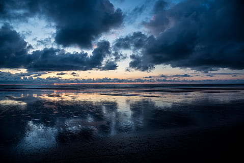 calm body of water under dark clouds, body of water under cloudy sky HD wallpaper