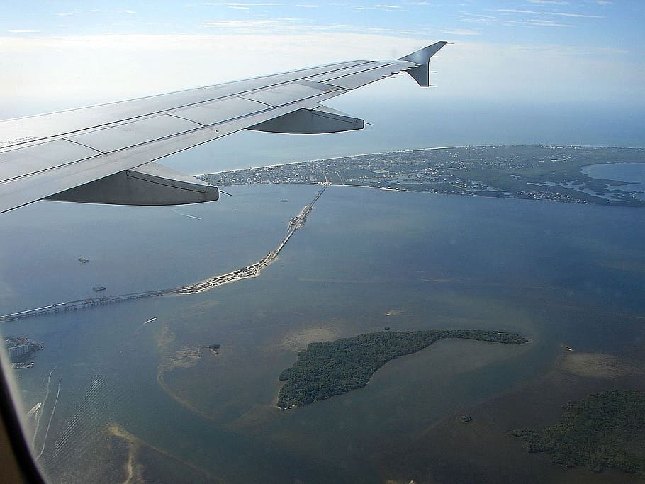 fly, plane, sky, ocean, water, island, bridge, boat, clouds HD wallpaper