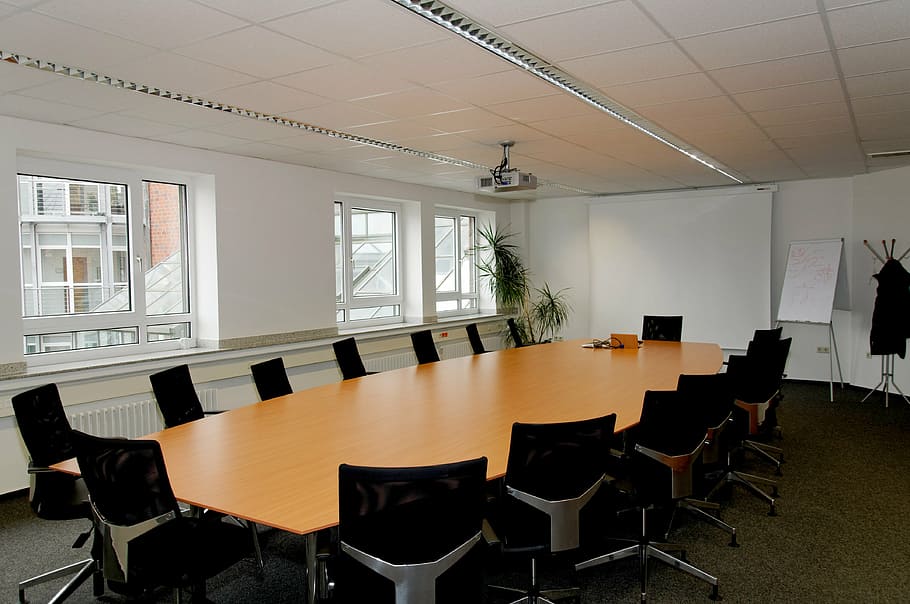 conference room with chairs and table, beamer, window, indoors