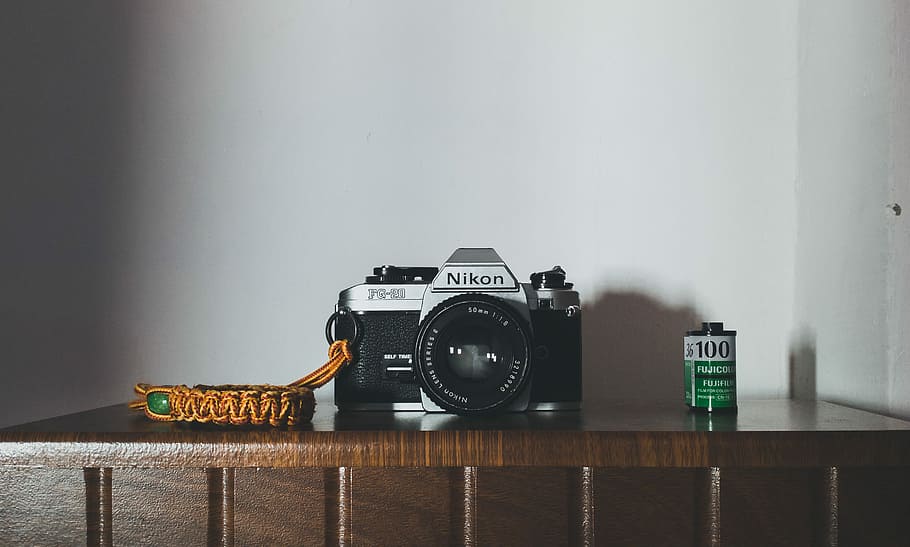 Nikon FG-20, black and gray Nikon camera on brown wooden table HD wallpaper