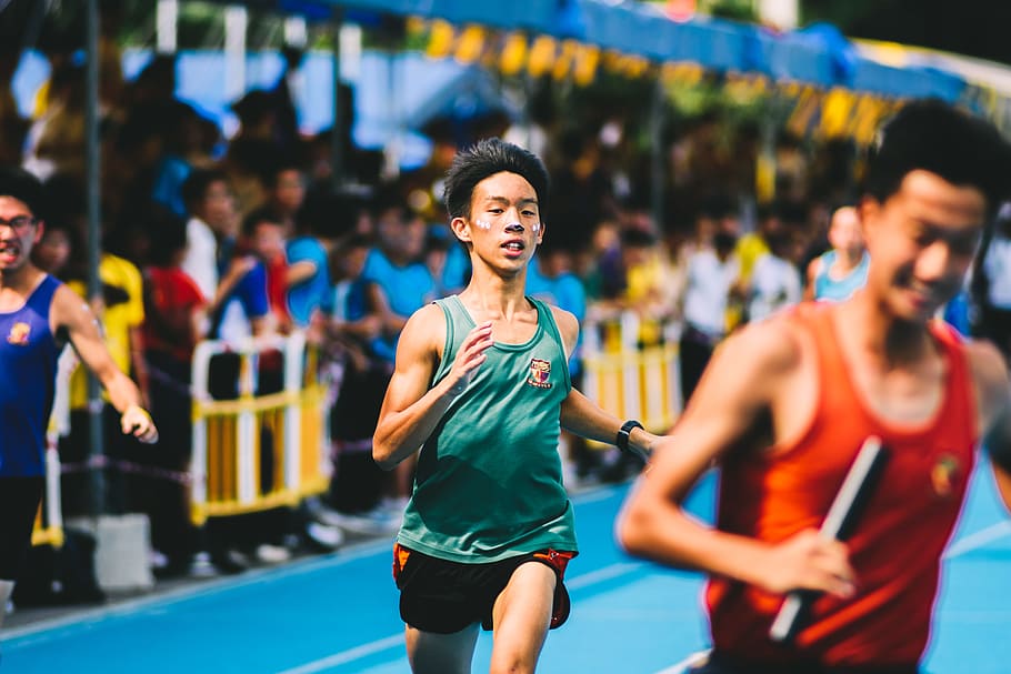 tilt shift lens photography of boy in green tank top and black sports shorts HD wallpaper