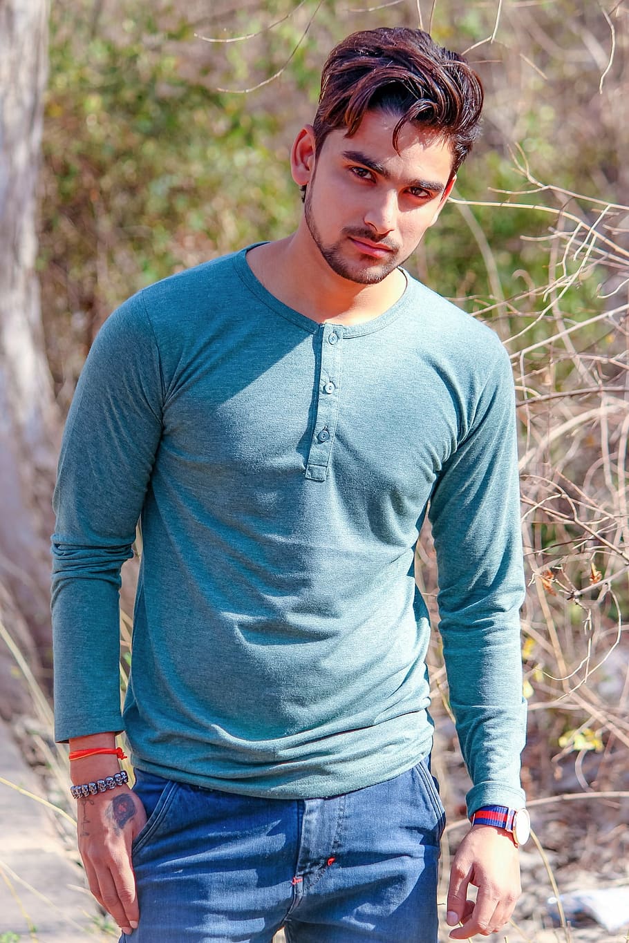 man wearing blue Henley shirt, india, male model, outdoors, casual clothing