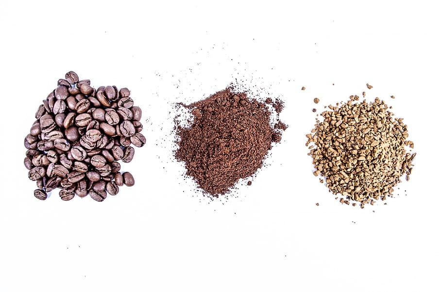 coffee beans and two black and beige powders on white surface HD wallpaper