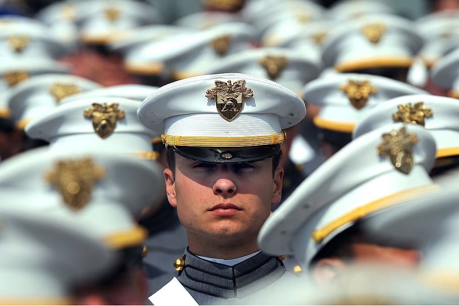 selective focus photography of man wearing military cap, graduation